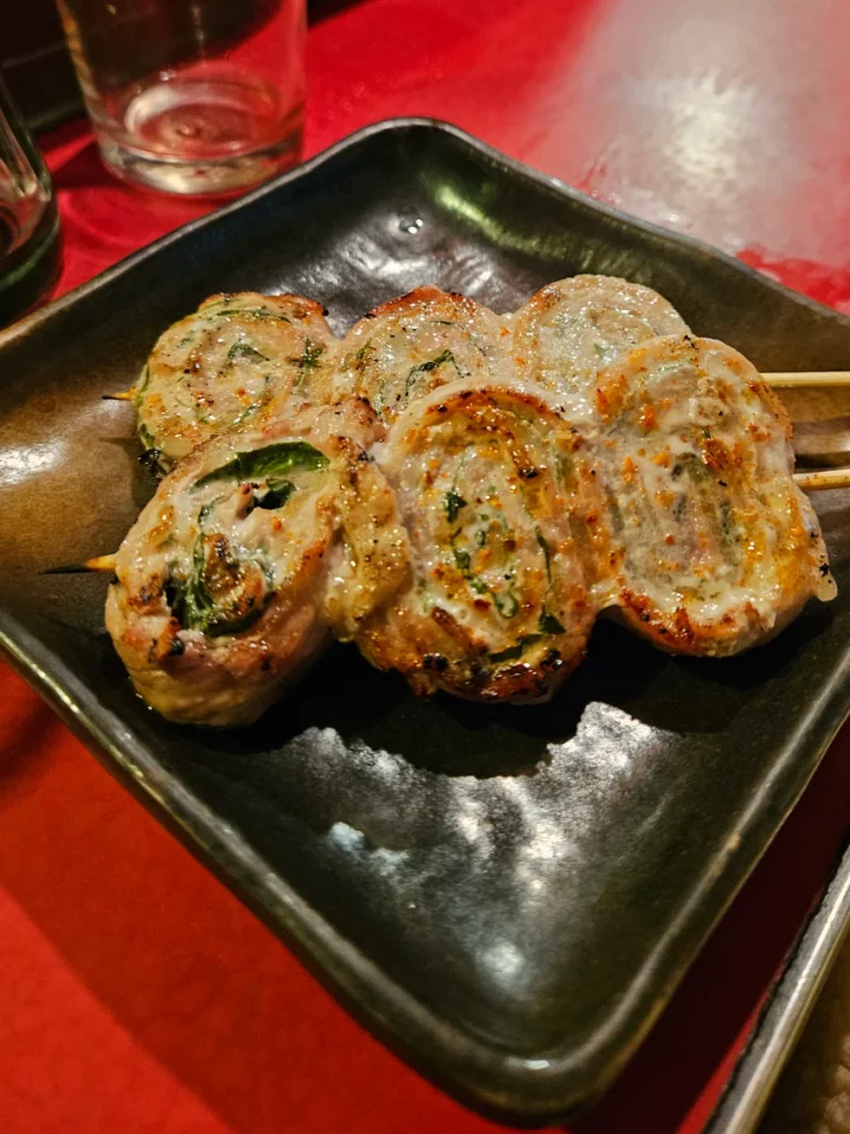 Glistening pork belly and shiso leaf yakitori.