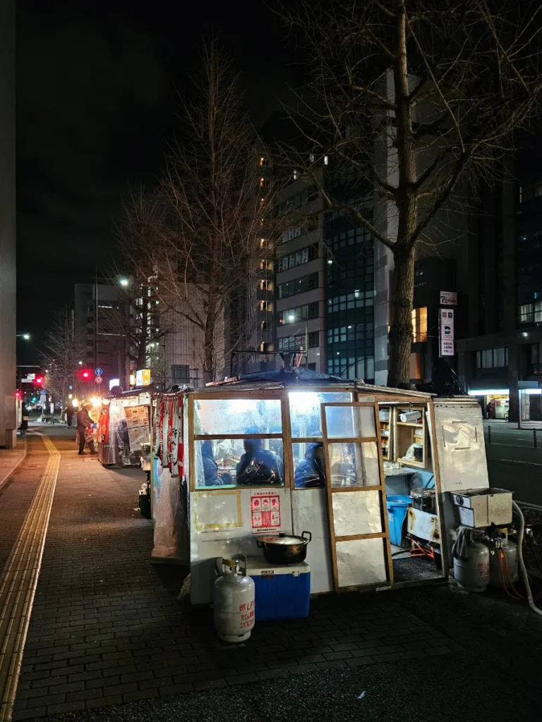 Outside view of two yatai lining the street in Fukuoka, Japan.