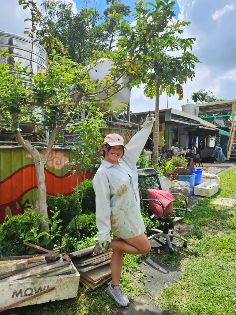 Zoe posing for a photo at a farm in the mountains of Chiayi.