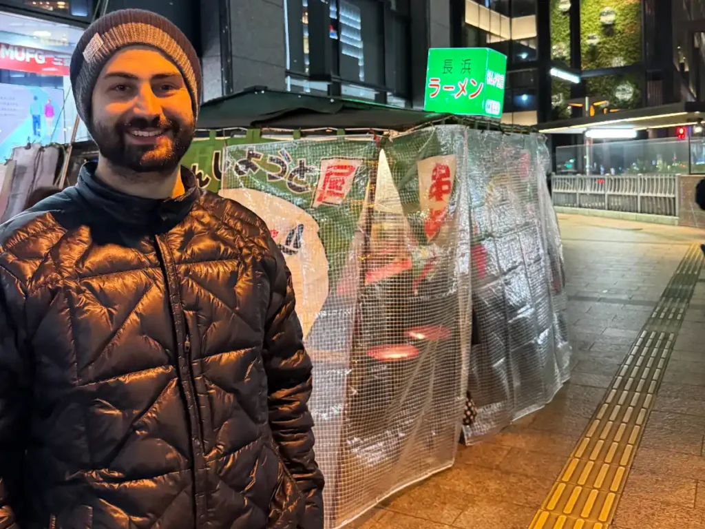 Tim standing in front of a green yatai in Tenjin, Fukuoka.