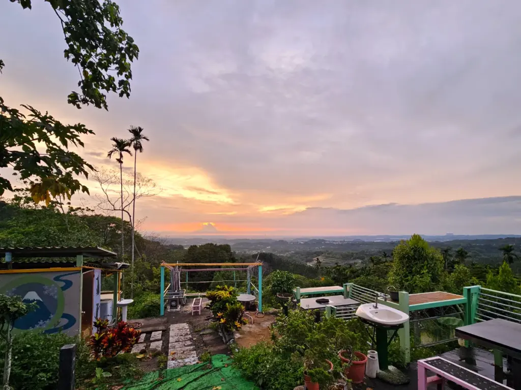 A sunset view looking out over the mountains and landscape from Steve's farm while living local in Taiwan.