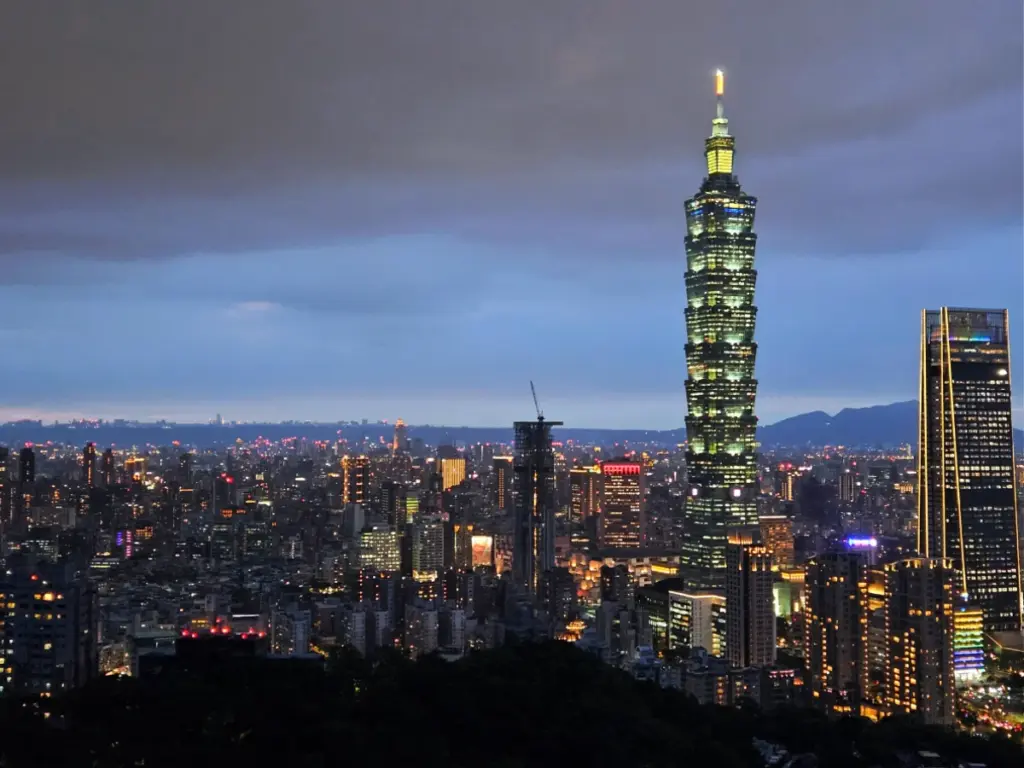 A stunning night view of the illuminated Taipei skyline and Taipei 101 from the Elephant Mountain hike.